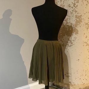 Green pleated skirt